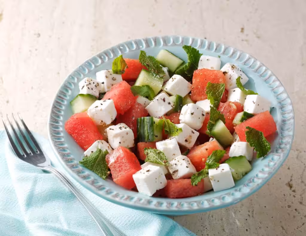 A bowl of feta, watermelon and cucumber salad