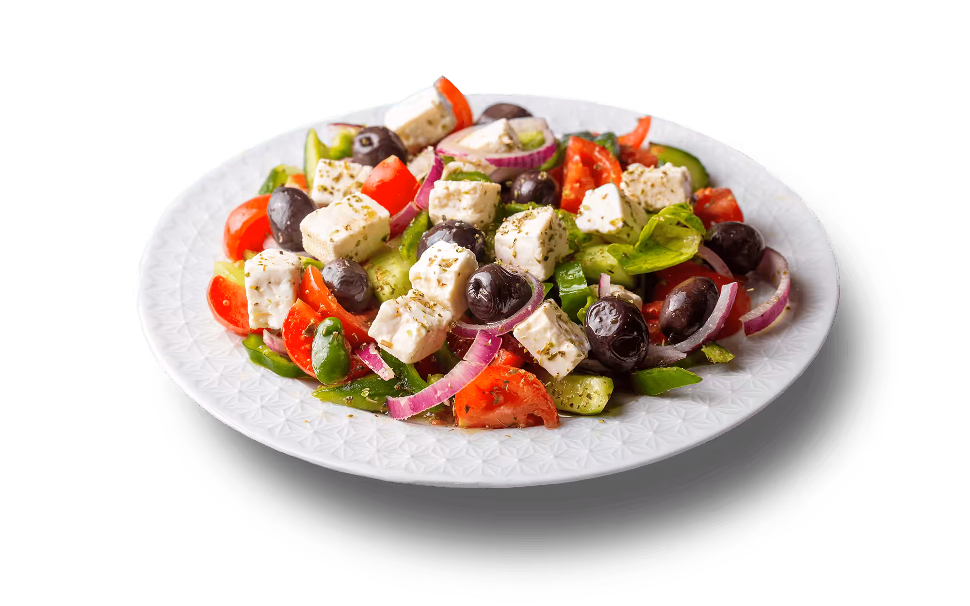 Plate of greek salad, with tomatoes, peppers, olives, red onions and feta cheese